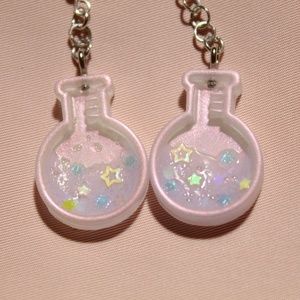 Magic potion dangle earrings